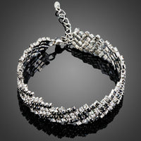 KHAISTA black zig zag CZ bracelet on white background