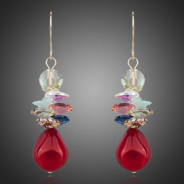 KHAISTA deep red crystal cluster drop earrings on white background
