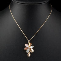 Close up detail of KHAISTA blooming flower crystal necklace
