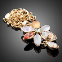 Side angle view of KHAISTA blooming flower crystal necklace