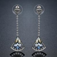 Side angle view of KHAISTA blue Austrian crystal drop earrings