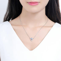 KHAISTA blue Austrian crystal shield pendant necklace on white background