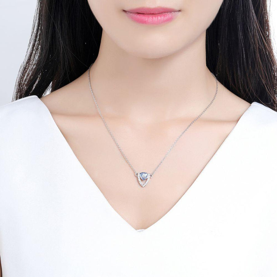 KHAISTA blue Austrian crystal shield pendant necklace on white background