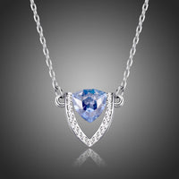 Close up detail of KHAISTA blue Austrian crystal shield pendant necklace