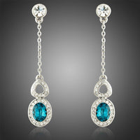 KHAISTA blue Austrian crystal drop earrings on white background