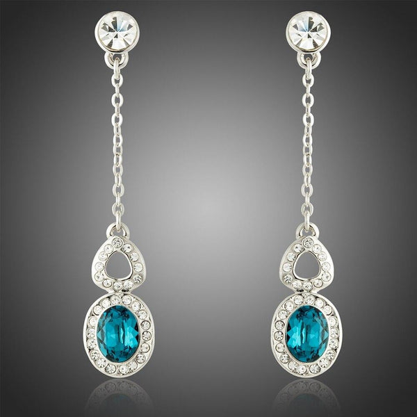 KHAISTA blue Austrian crystal drop earrings on white background