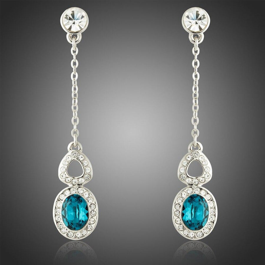 KHAISTA blue Austrian crystal drop earrings on white background