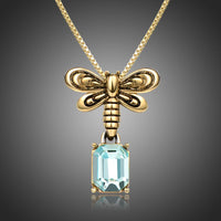 Side angle view of KHAISTA blue Austrian crystal pendant necklace