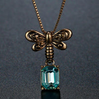 KHAISTA blue Austrian crystal pendant necklace on white background