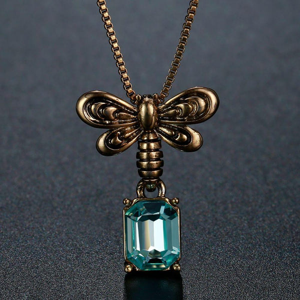 KHAISTA blue Austrian crystal pendant necklace on white background