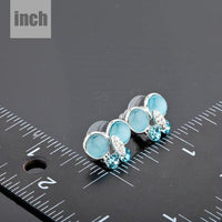 blue butterfly stud earrings detail view by KHAISTA