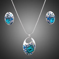 Khaista blue crystal necklace and earrings set on white background