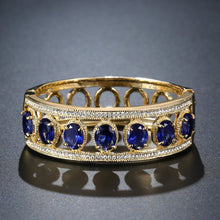 Load image into Gallery viewer, Blue Crystals Golden Design Bangle -KBQ0113 - KHAISTA Fashion Jewelry
