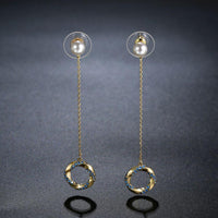 KHAISTA blue CZ pearl dangle earrings on white background
