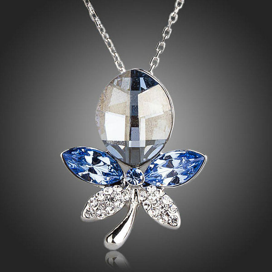 KHAISTA blue crystal dragonfly pendant necklace on white background