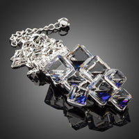 Close up detail of KHAISTA blue effect crystal cluster necklace