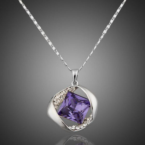 KHAISTA blue crystal love pendant necklace on white background