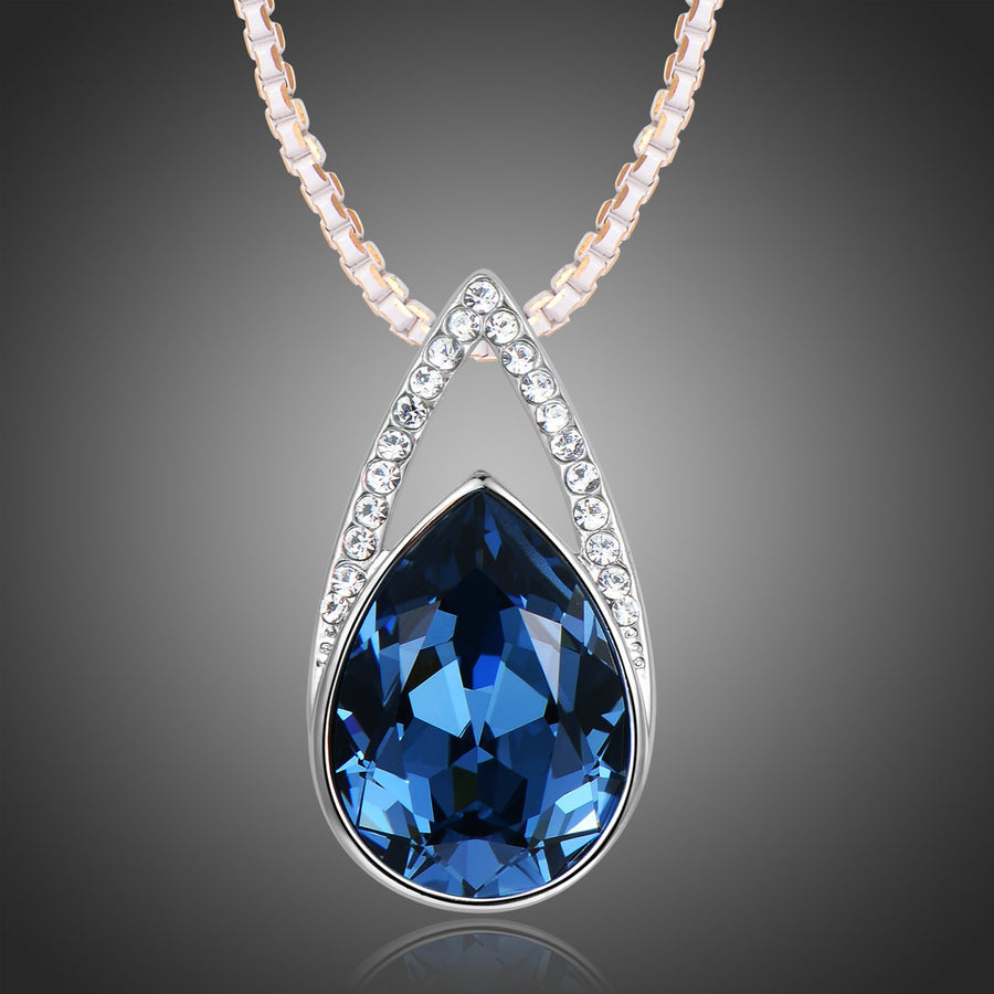KHAISTA blue pear crystal pendant necklace on white background