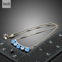 Pendant detail on KHAISTA blue resin Austrian crystal pendant necklace