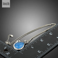 Pendant detail on KHAISTA blue crystal swan pendant necklace