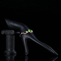 Close up detail of KHAISTA bold green stone designer bracelet