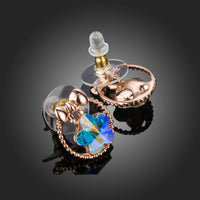 Close up of KHAISTA bow knot crystal flower stud earrings
