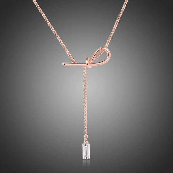 KHAISTA crystal bow knot pendant necklace on white background
