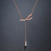 Pendant detail on KHAISTA crystal bow knot pendant necklace