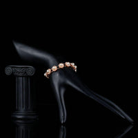 Side angle view of KHAISTA budding flower pearl bracelet