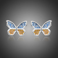 KHAISTA butterfly cubic zircon stud earrings on white background