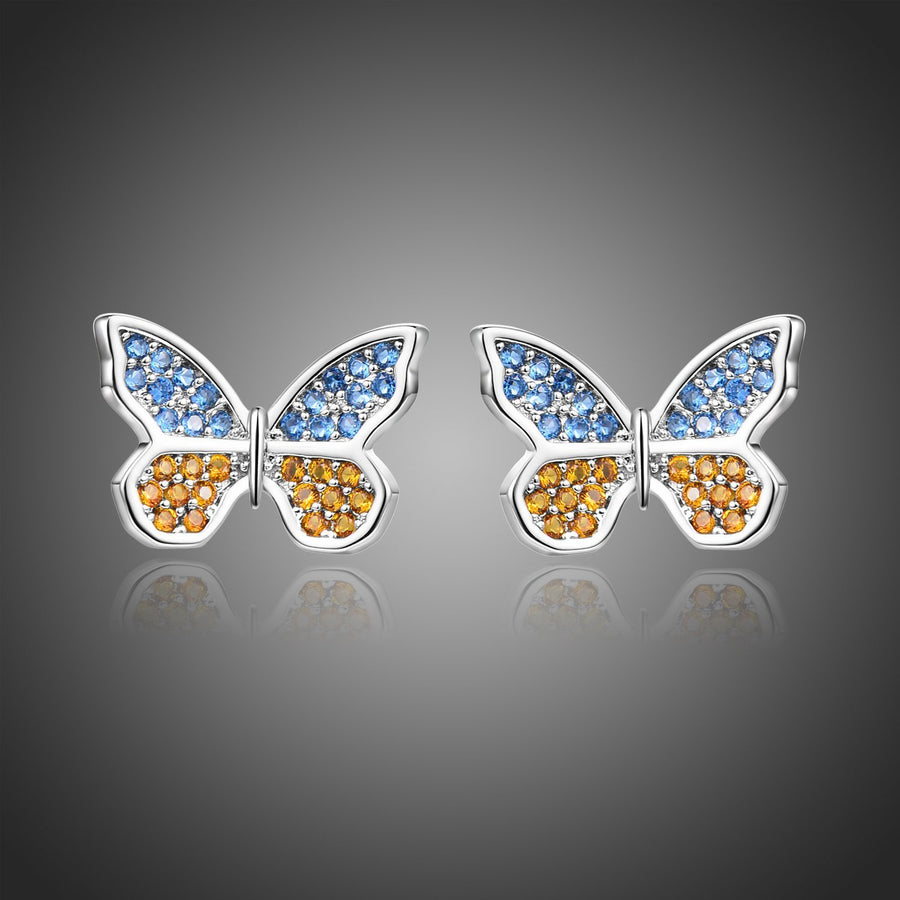 KHAISTA butterfly cubic zircon stud earrings on white background