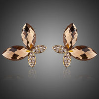 KHAISTA gold Stellux butterfly stud earrings on white background
