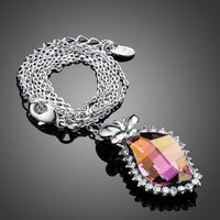 Close up detail of KHAISTA butterfly on autumn leaf crystal pendant necklace