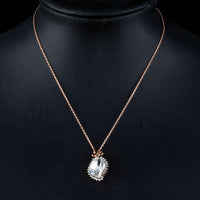 Side angle view of KHAISTA butterfly on crystal pendant necklace
