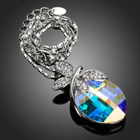 Side angle view of KHAISTA butterfly on crystal pendant necklace