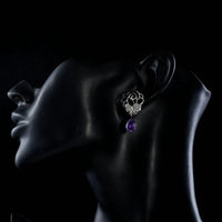 Side angle view of KHAISTA butterfly on flower crystal drop earrings