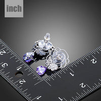 butterfly on flower crystal drop earrings detail view by KHAISTA