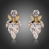 KHAISTA butterfly on leaf crystal drop earrings on white background