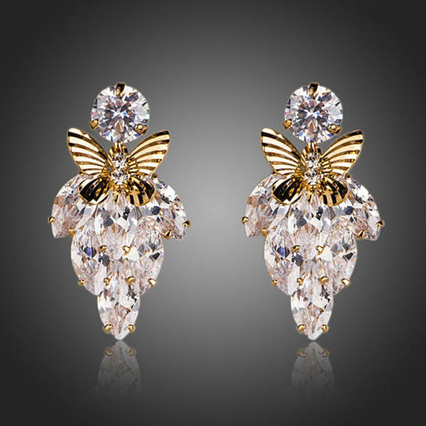 KHAISTA butterfly on leaf crystal drop earrings on white background