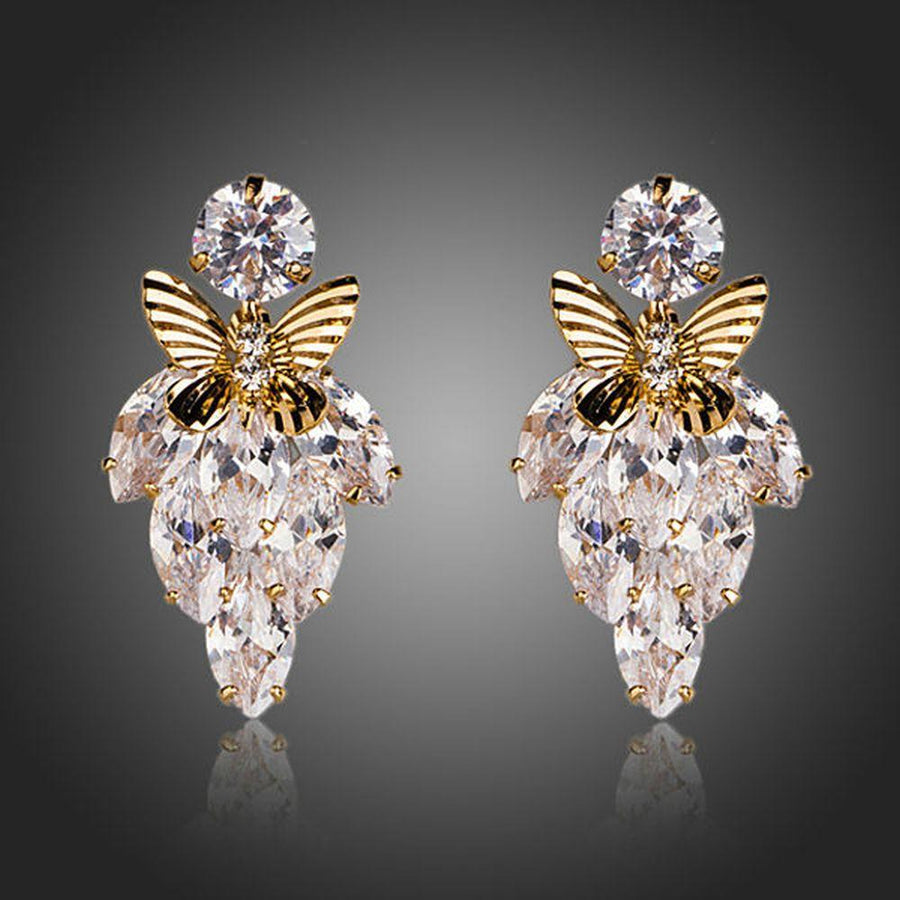 KHAISTA butterfly on leaf crystal drop earrings on white background