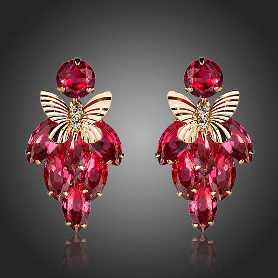 KHAISTA crystal butterfly raspberry drop earrings on white background