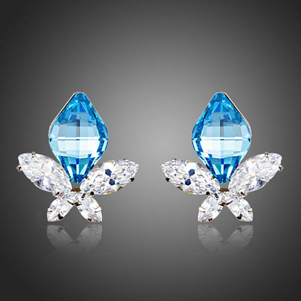 KHAISTA sea blue crystal butterfly stud earrings on white background