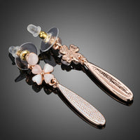 Close up of KHAISTA cactus flower crystal drop earrings