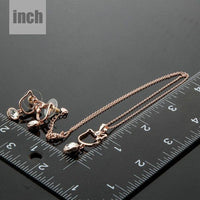 Cat motif detail on Khaista rose gold crystal set