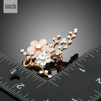 Close-up of cat's eye stones on Khaista flower brooch