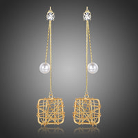 KHAISTA chain square pearl drop earrings on white background
