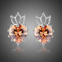 KHAISTA champagne cubic zirconia earrings on white background