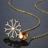 Pendant detail on KHAISTA champagne CZ snowflake pendant necklace