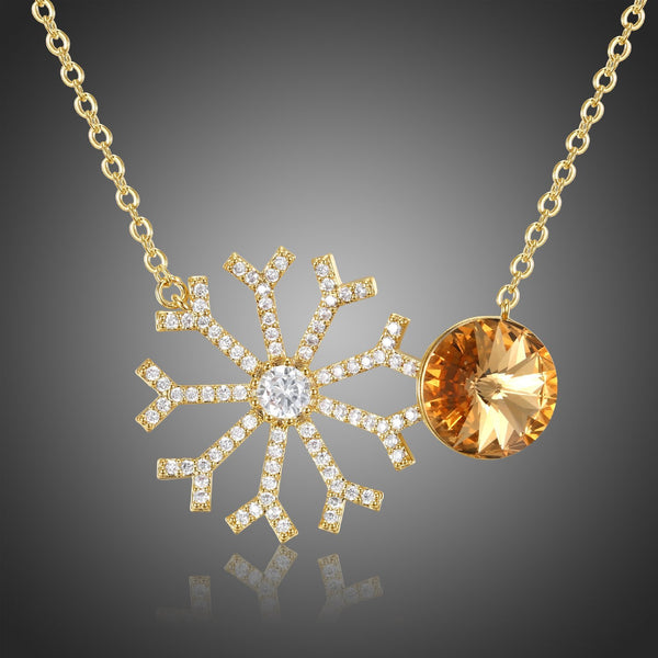 KHAISTA champagne CZ snowflake pendant necklace on white background