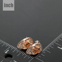 champagne CZ stud earrings detail view by KHAISTA